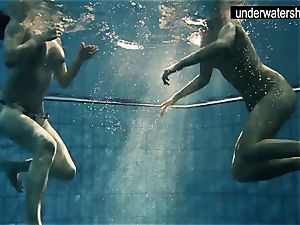 two cool amateurs displaying their figures off under water